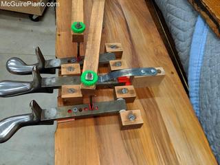 Repairing the bottom board of an upright piano
